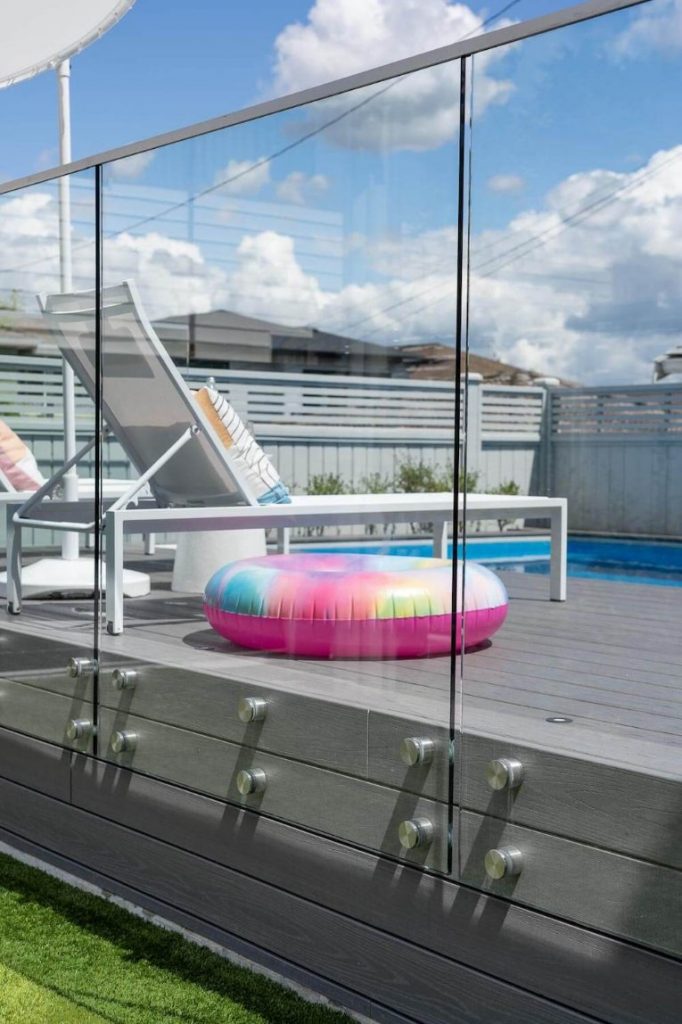 Glass railing around pool deck - Novero Design Centre